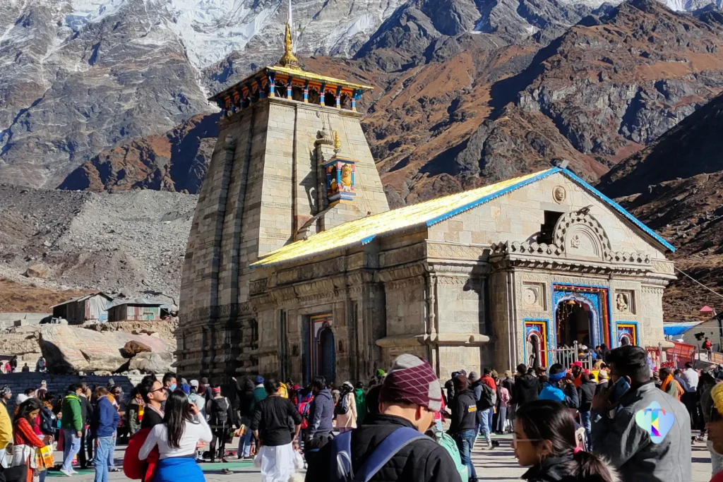 Breathtaking helicopter perspective of the Do Dham Yatra, capturing the serene landscapes and spiritual ambiance of Kedarnath and Badrinath temples, ideal for pilgrims traveling from Delhi.