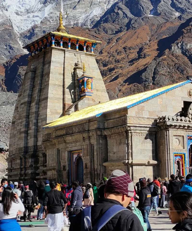 Breathtaking helicopter perspective of the Do Dham Yatra, capturing the serene landscapes and spiritual ambiance of Kedarnath and Badrinath temples, ideal for pilgrims traveling from Delhi.